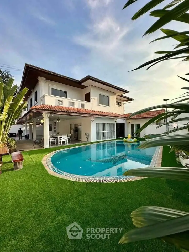 Luxurious two-story villa with private pool and lush garden, perfect for serene living.
