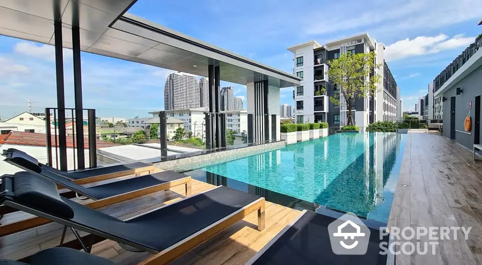 Luxurious rooftop pool with stunning city views in modern apartment complex