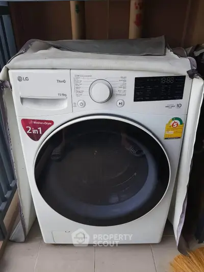 Modern LG washer dryer combo on a balcony, perfect for efficient laundry solutions in compact spaces.