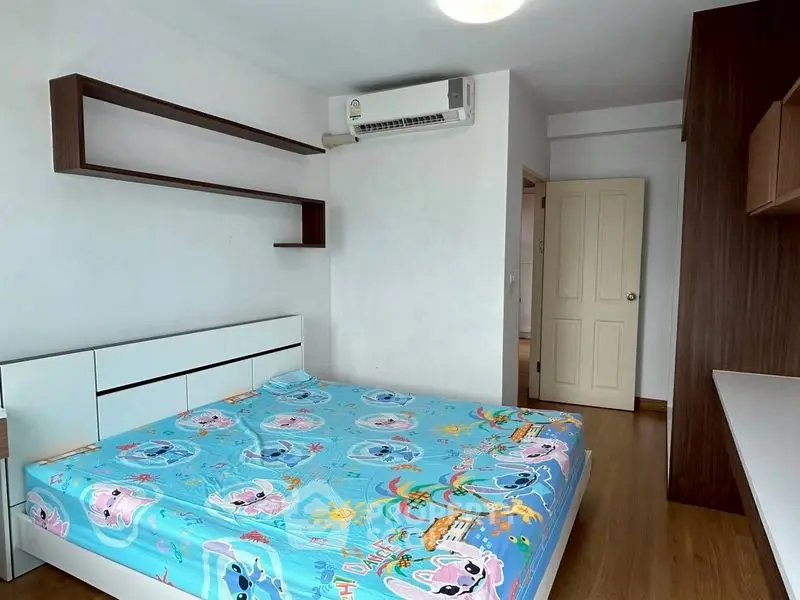 Cozy bedroom with colorful bedding and modern air conditioning unit