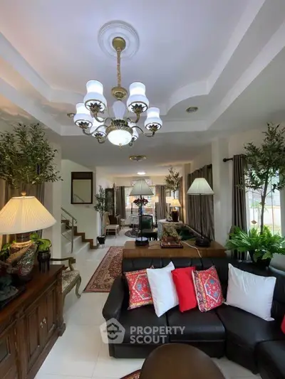 Luxurious living room with elegant chandelier and stylish decor