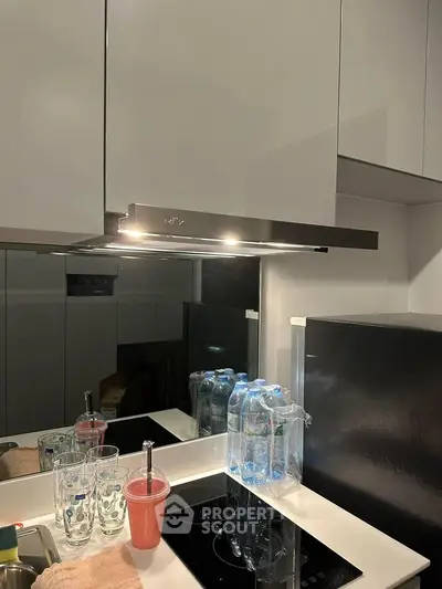 Modern kitchen with sleek cabinetry and induction cooktop