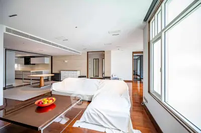 Spacious modern living room with open kitchen and large windows