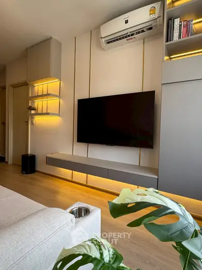 Modern living room with sleek TV setup and ambient lighting