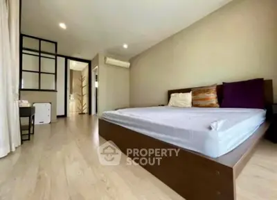 Spacious bedroom with modern design and natural light