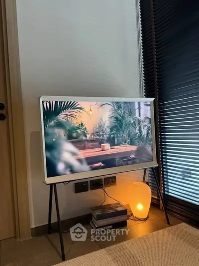 Stylish modern living room corner with TV and ambient lighting