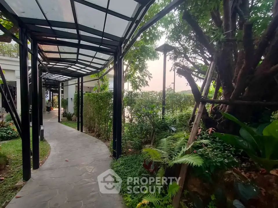 Charming garden pathway with lush greenery and modern canopy design