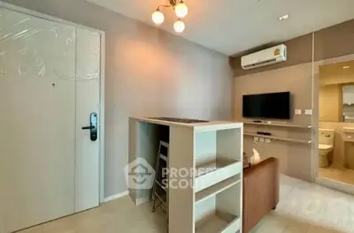 Modern apartment interior with stylish living area and compact kitchen design.
