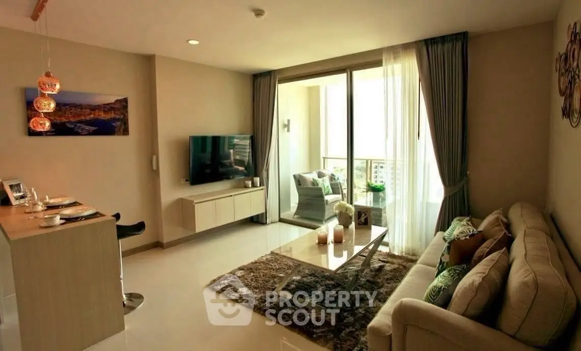 Modern living room with stylish decor and balcony view in a cozy apartment.