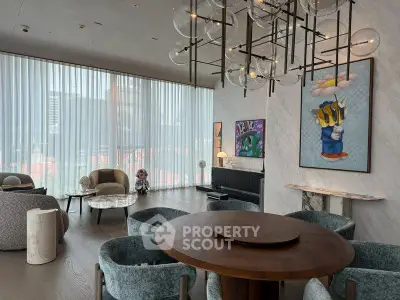 Luxurious living room with modern decor, large windows, and elegant chandelier in high-rise apartment.