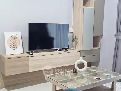 Modern living room with sleek wooden furniture and flat-screen TV, perfect for contemporary living.