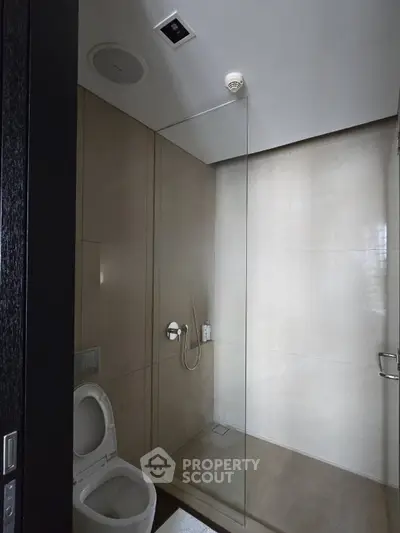 Modern bathroom with sleek glass shower and contemporary fixtures