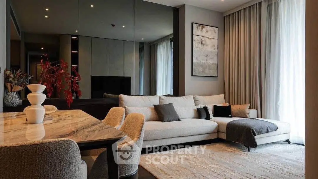 Luxurious modern living room with elegant decor and cozy seating area.