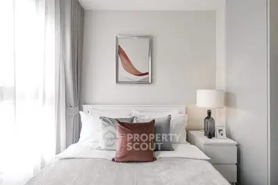 Modern bedroom with stylish decor and natural light