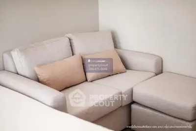 Cozy beige sofa in modern living room with neutral decor