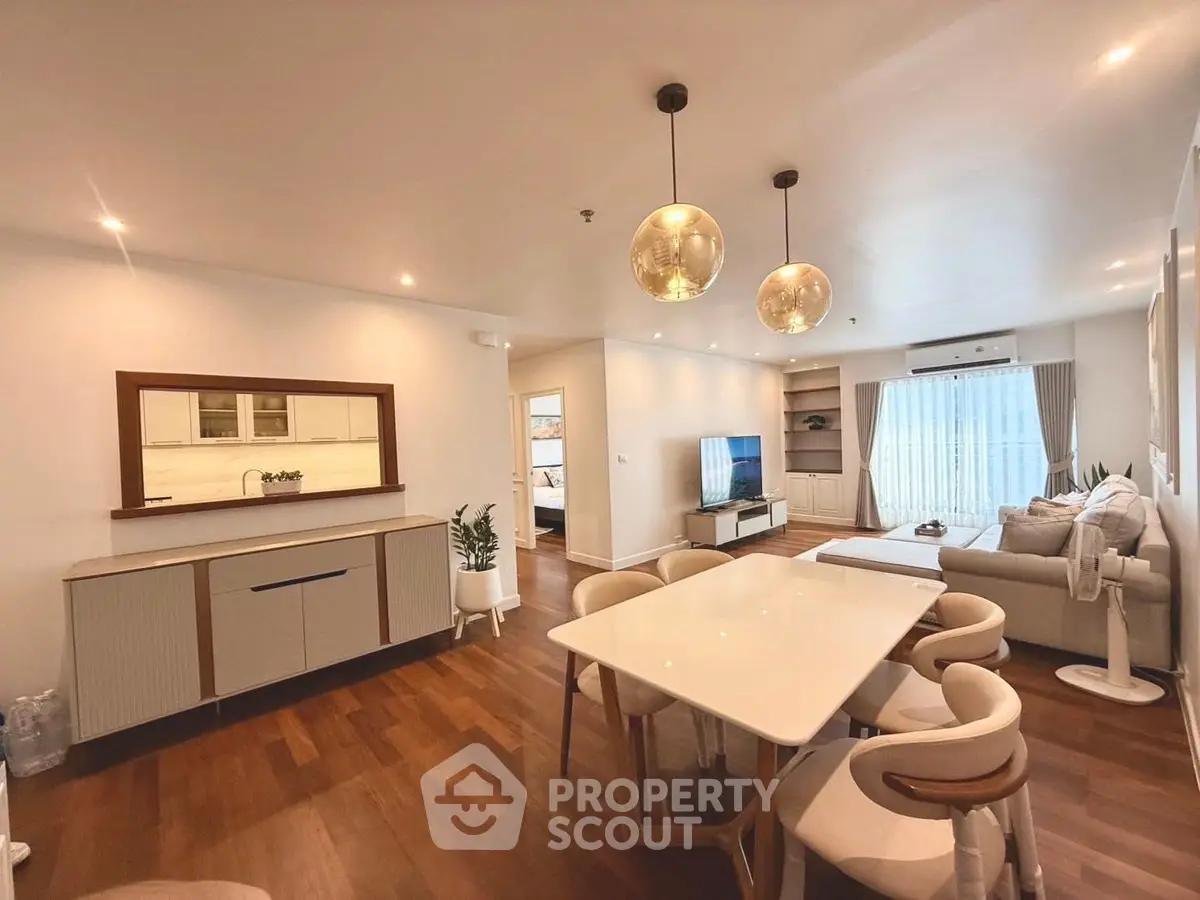 Spacious modern living room with elegant dining area and stylish decor