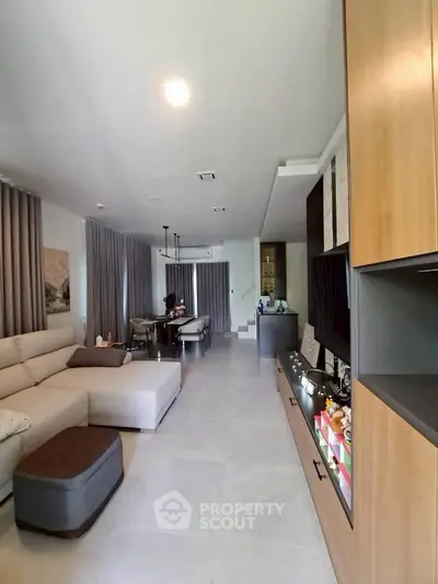 Spacious modern living room with elegant decor and ample natural light