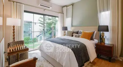 Luxurious bedroom with garden view, elegant decor, and natural light.