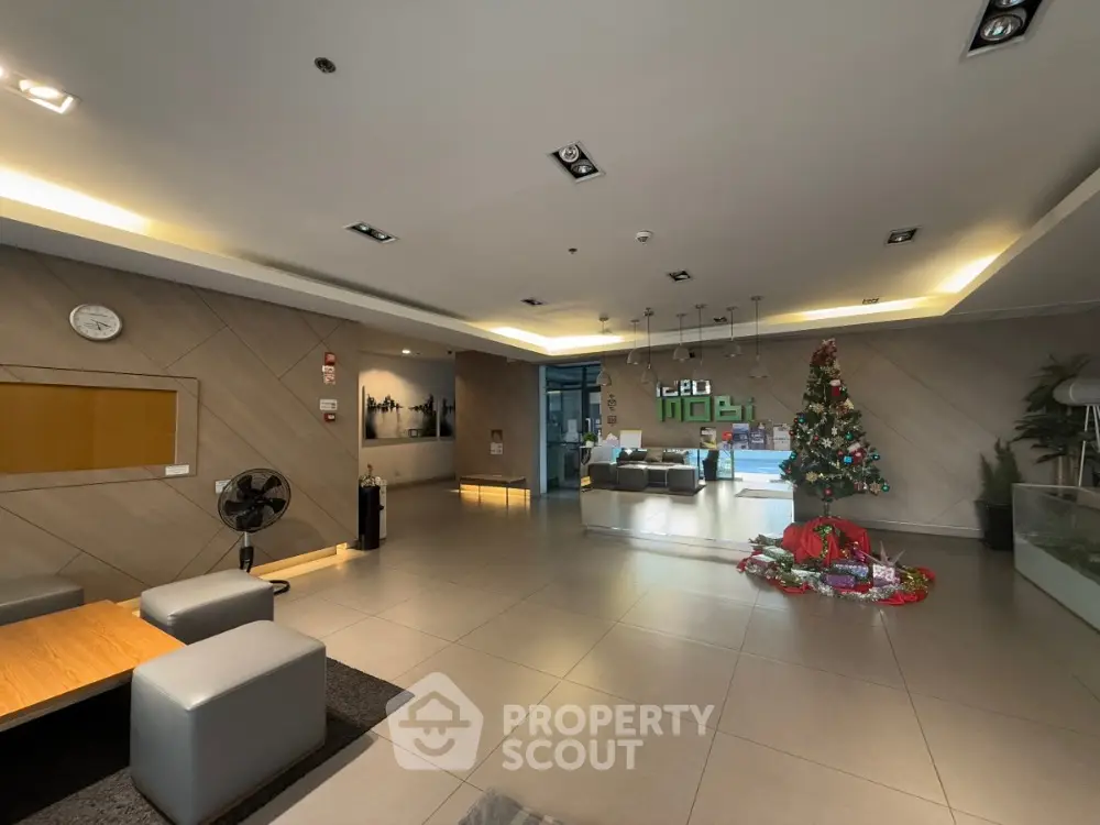 Modern building lobby with Christmas decorations and seating area