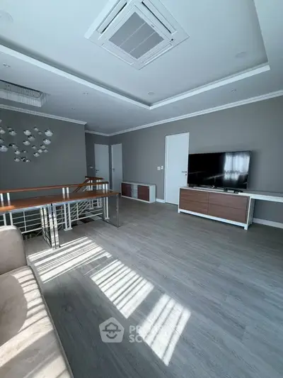 Spacious modern living room with sleek design and natural light