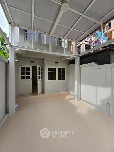 Spacious covered patio with modern design and ample natural light