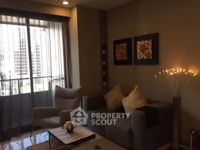 Stylish modern living room with elegant decor and city view balcony.