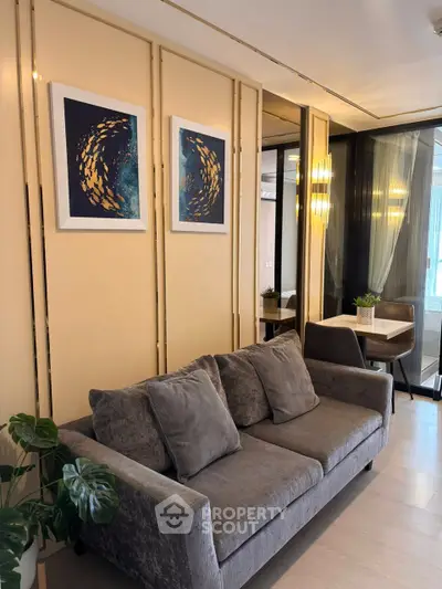 Elegant living room with plush gray sofa and modern decor accents