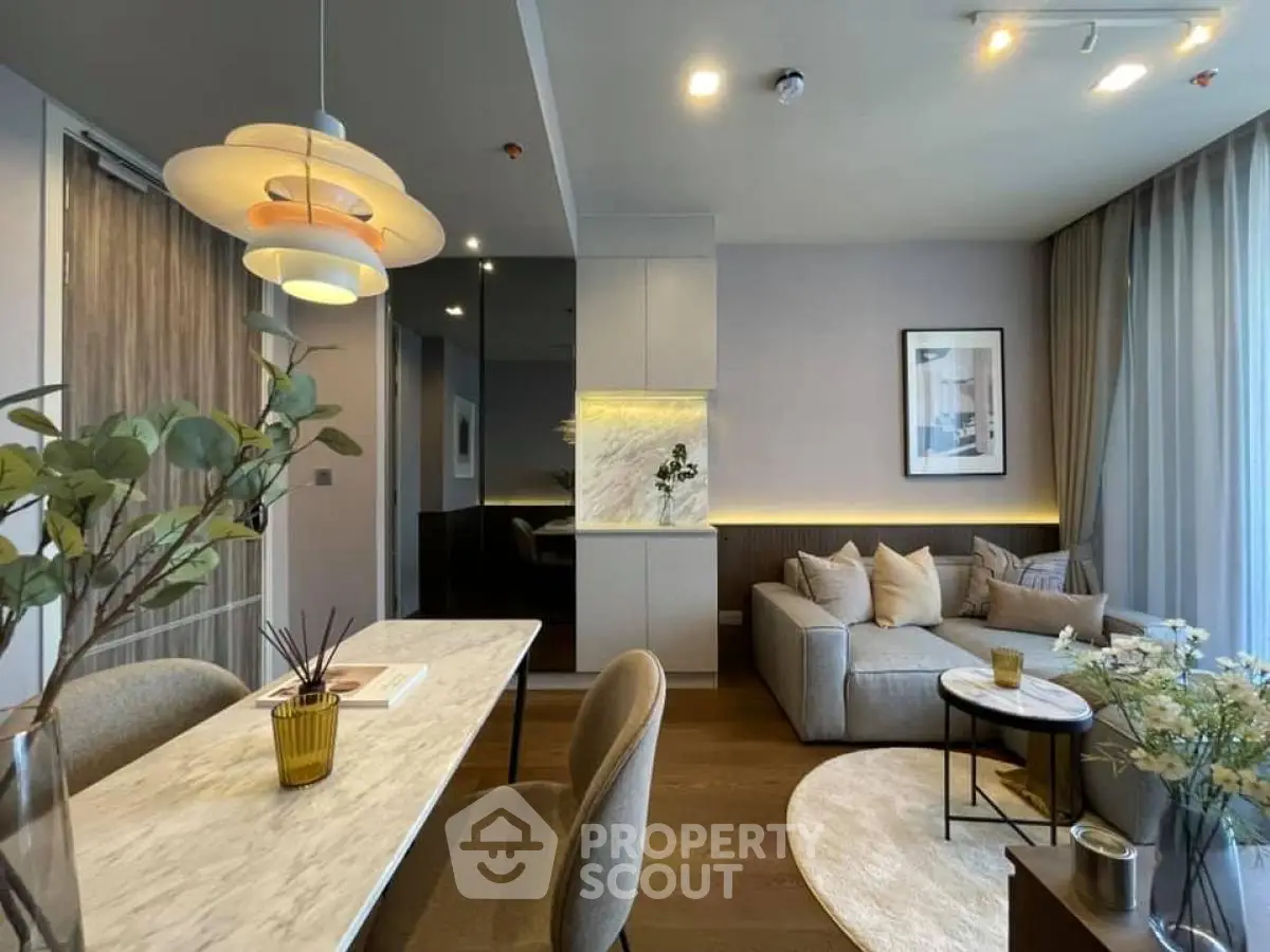 Modern living room with stylish decor and cozy seating area, perfect for relaxation and entertaining.