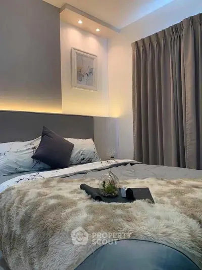 Luxurious bedroom with elegant decor and plush bedding
