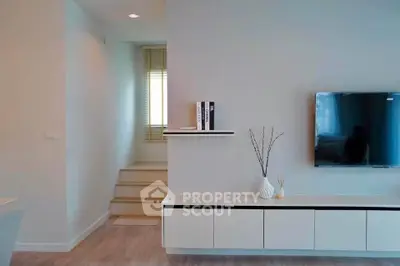 Modern living room with sleek TV setup and minimalist decor