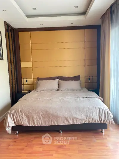 Luxurious bedroom with elegant design and floor-to-ceiling windows