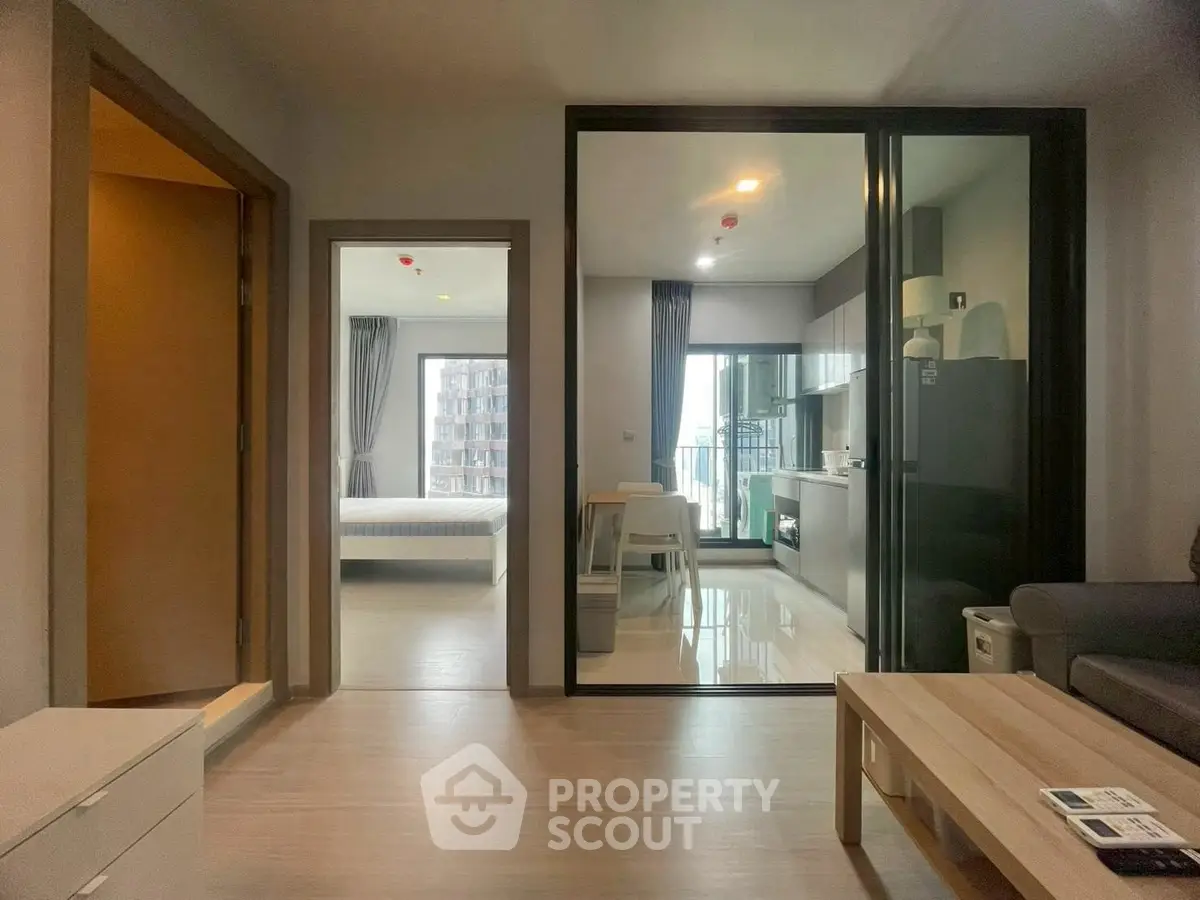 Modern apartment interior with open kitchen and cozy living area