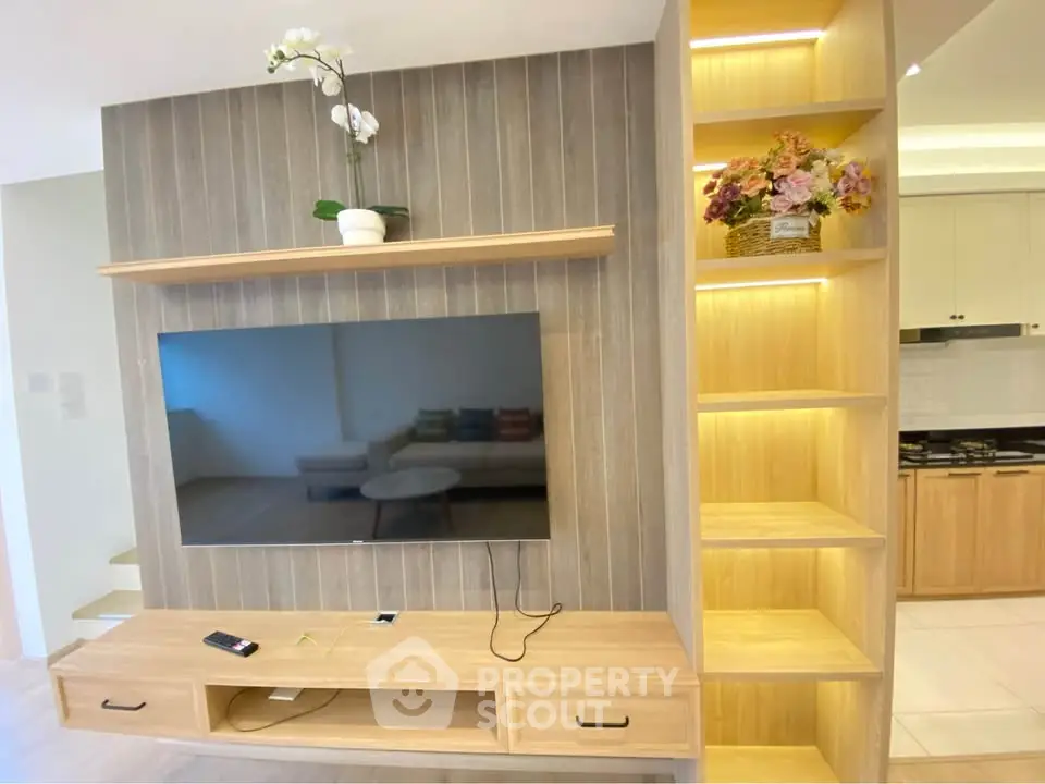 Modern living room with stylish TV unit and elegant shelving, perfect for contemporary home decor.