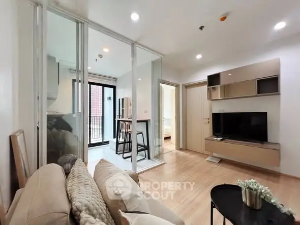 Modern living room with open layout and stylish decor in a contemporary apartment.