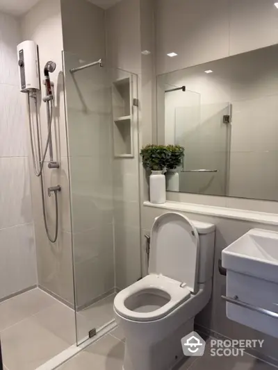 Modern bathroom with glass shower and sleek fixtures