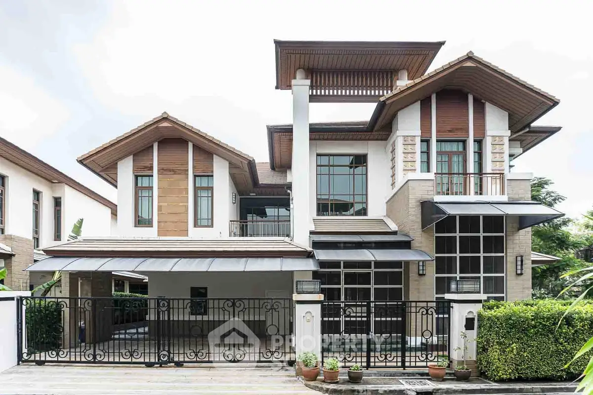 Elegant modern house with large windows and stylish architectural design, perfect for luxurious living.