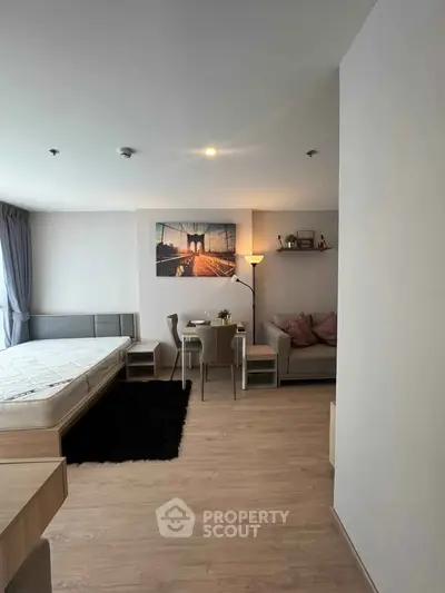 Modern studio apartment with cozy living area and stylish decor