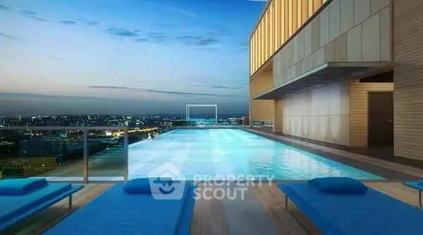 Luxurious rooftop pool with stunning city skyline views at sunset.