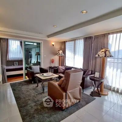 Spacious living room with elegant decor and ample natural light