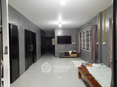 Spacious modern living room with sleek design and large windows
