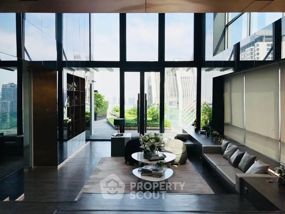 Luxurious living room with floor-to-ceiling windows and stunning city view