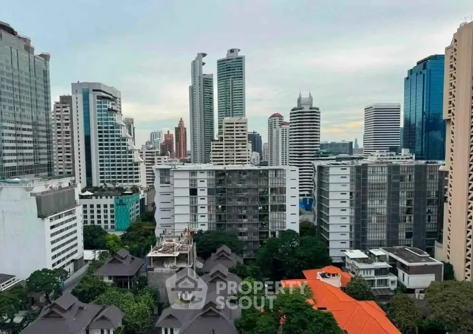 Stunning cityscape view of modern high-rise buildings and lush greenery in a vibrant urban setting.