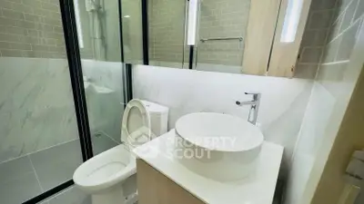 Modern bathroom with sleek design and glass shower enclosure