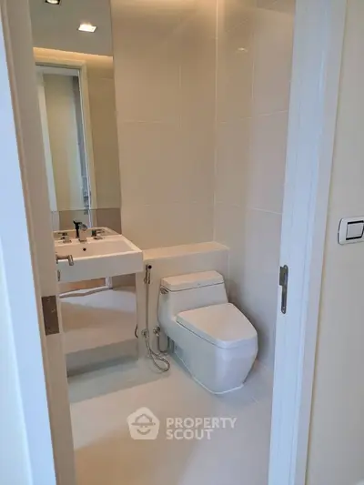 Modern compact bathroom with sleek fixtures and minimalist design