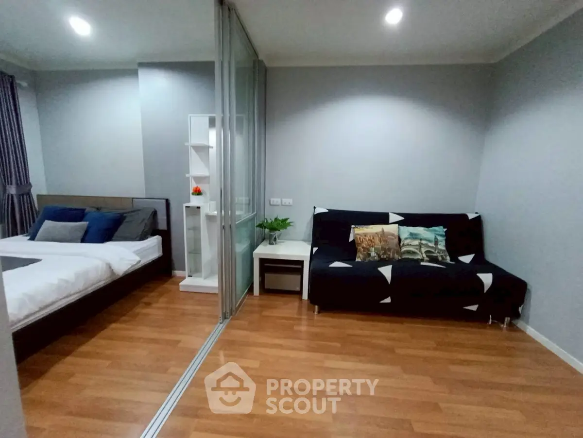 Modern studio apartment with cozy bedroom and stylish living area