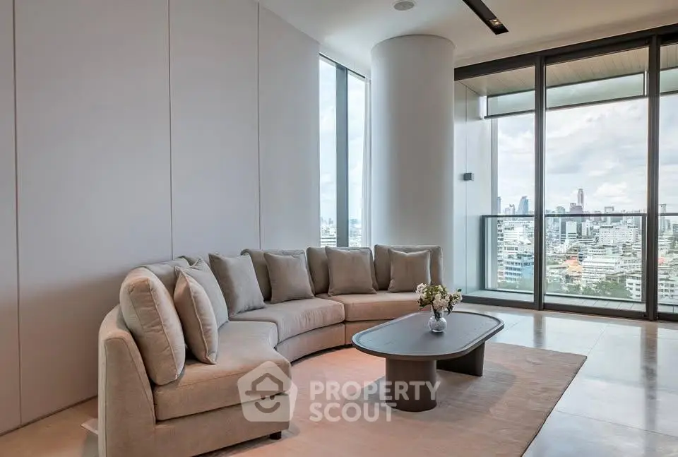Luxurious modern living room with panoramic city views and elegant furniture.