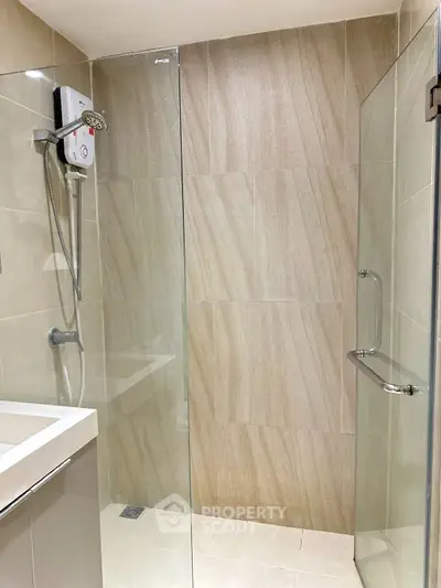Modern bathroom with glass shower and sleek tile design