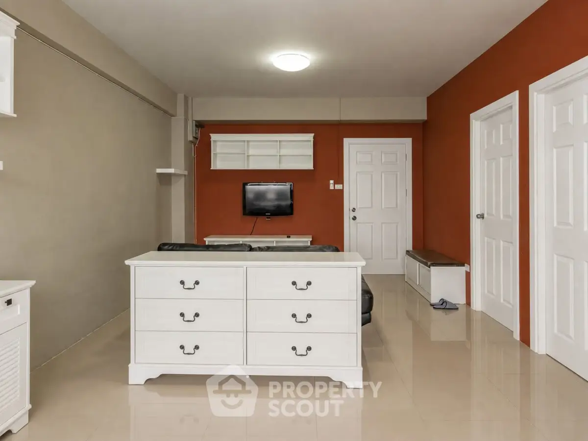 Modern living room with stylish furniture and vibrant accent wall