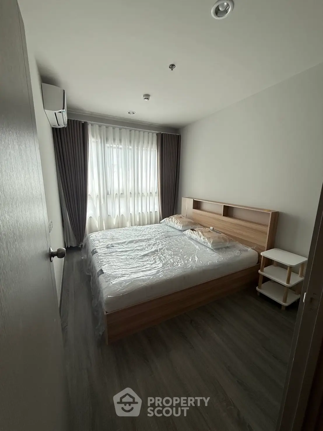 Cozy bedroom with modern wooden furniture and natural light