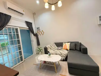 Stylish living room with modern decor and cozy seating area, perfect for relaxation.